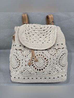 The Sak Sayulita Backpack Crochet Drawstring with Tan Straps